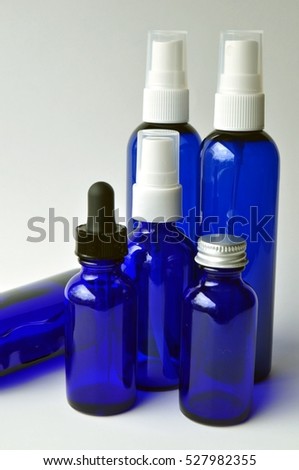 Dark blue glass bottles for cosmetic lotions, serums, oils and liquids