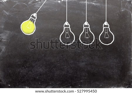 bulbs on blackboard
