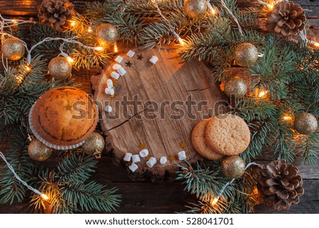 Christmas Cupcakes and Cookies on Wooden Background. Horizontal.