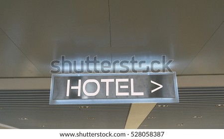 HOTEL text written on shiny signboard