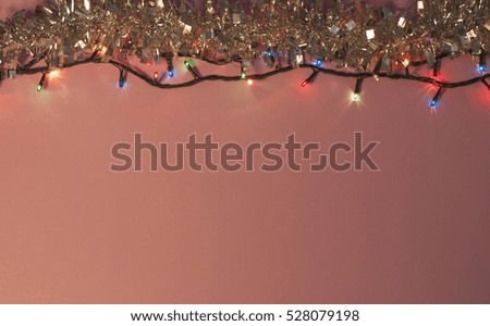 Beautiful background with Christmas lights and red Christmas decoration balls .