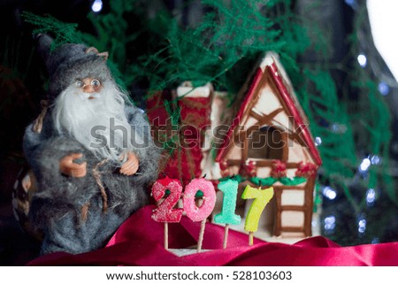 Santa christmas house with candles for 2017 new year