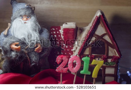 Santa christmas house with candles for 2017 new year