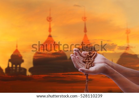 Pray earnestly hope for Middle East peace,Wish empty hand of man blurred background Mosque,Pilgrims pray blurred background mosque,1443 Ramadan festival concept