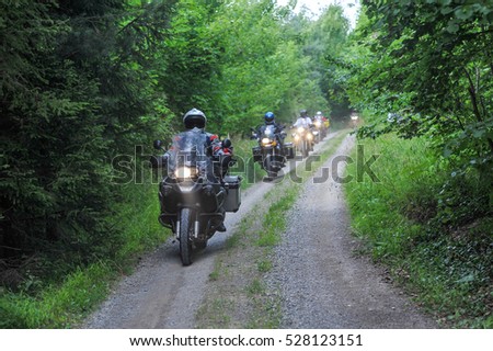 Motorcyclists convoy in the forest