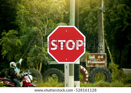 Road traffic signs say stop waiting.