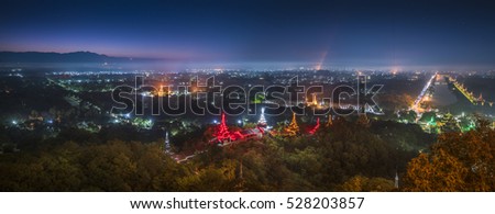 Beautiful Pagoda and landscape of Mandalay with light in the early morning, Top view beautiful countryside in the morning at Mandalay hill in Myanmar.