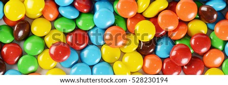 The closeup of pile colorful chocolate candies