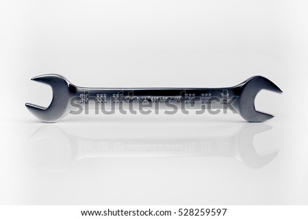 Open-end wrench isolated on white background. Still-life picture taken in studio with soft-box.