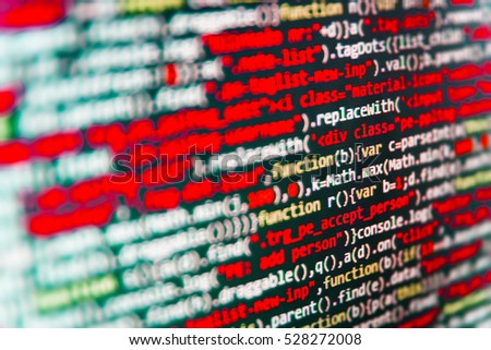 Software engineer at work. HTML website structure. Developer working on websites codes in office. Website codes on computer monitor. Hacker breaching net security. PHP syntax highlighted. 
