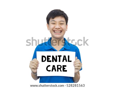 Asian teen beautiful smile teeth brace dental holding paper DENTAL CARE message on isolate background.
