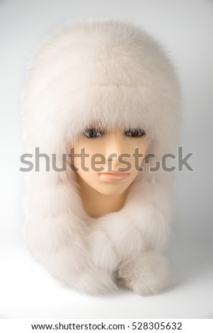 Women's hats from the fur on a mannequin on a white background