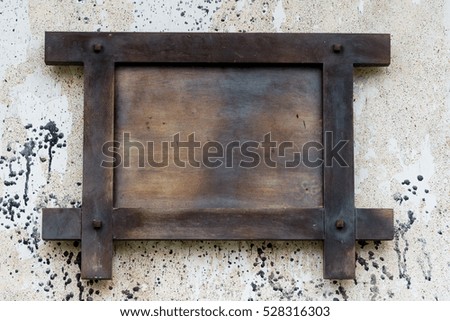 Blank Black and grey wooden board on wall  