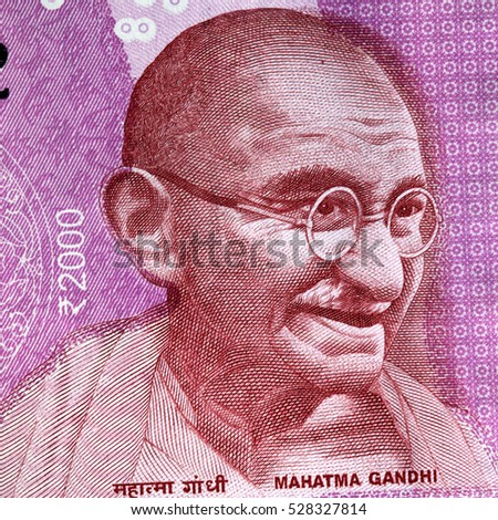 Mahatma Gandhi portrait on Indian 2000 rupee banknote macro, India money closeup Royalty-Free Stock Photo #528327814