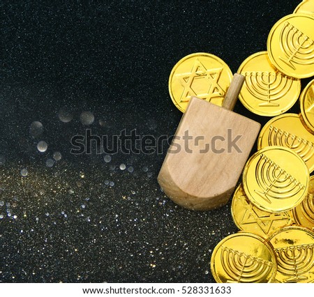 Image of jewish holiday Hanukkah with wooden dreidels (spinning top)