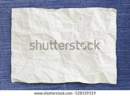 Note paper crumpled of empty and copy space on Denim background,You can input the message text in picture.