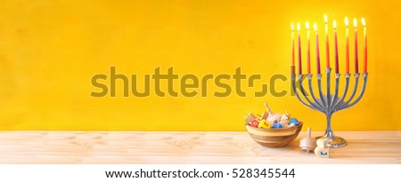 Image of jewish holiday Hanukkah with menorah (traditional Candelabra) and spinning top