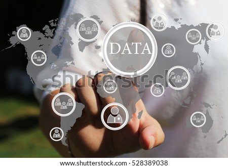Businesswoman push the icon DATA in the web network on the touch screen .