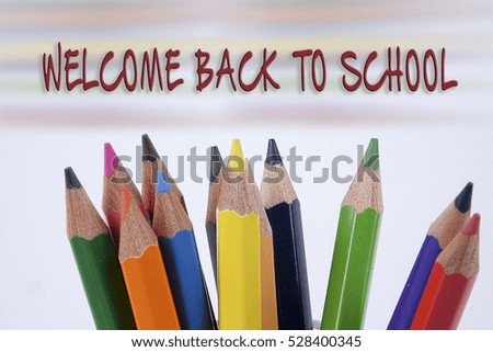 Colorful Colored Pencils Background in Welcome Back to School words.