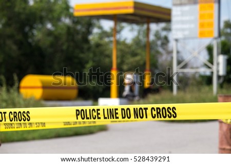 police line do no cross with gas station background in crime scene investigation training with copy space