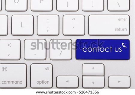 Contact us word written on computer keyboard.