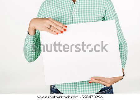 woman wearing holding a white board with empty copy space. image on a white studio background. business and lifestyle concept