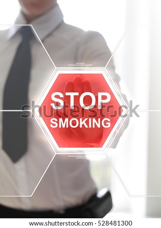 Stop smoking word sign hexagon health concept. Woman hand presses quit cigarette smoking red button on virtual touch medical screen. Medicine wellness healthcare.