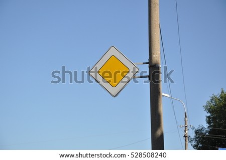 Main road sign on a pole