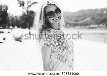 portrait of a smiling woman, happy girl in nature, positive walk on the beach with a sun girl. Film Texture & Unfocused