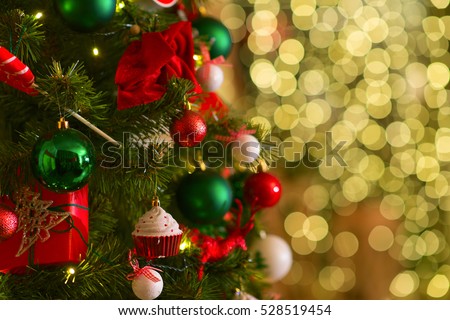 Red and green christmas tree decoration. Holidays background. Golden style toned picture