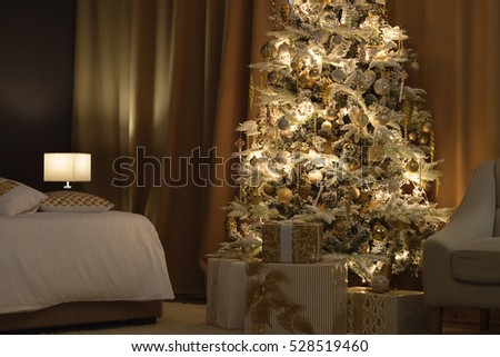 Golden christmas tree decoration. Holidays background. Golden style toned picture
