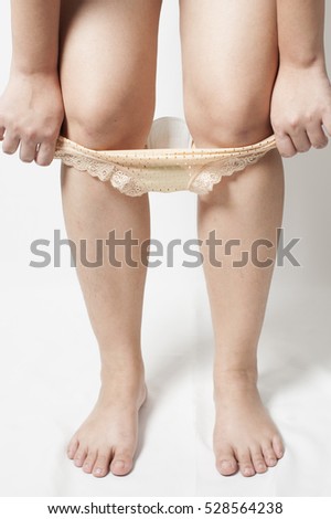 Woman with Sanitary Napkin isolated on white