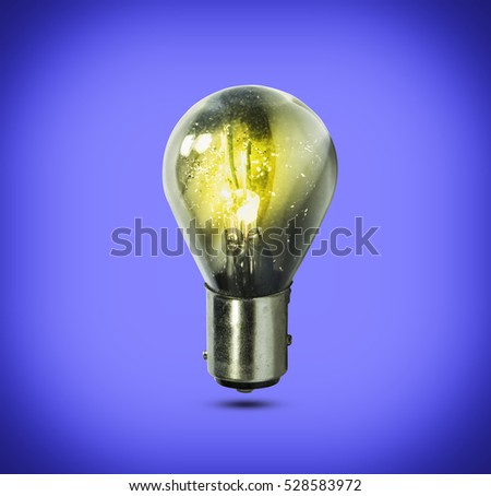Light bulb isolated on blue background