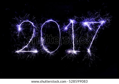  2017 from colorful sparkle on black background
