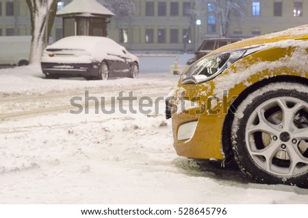 parked car in blizzard night