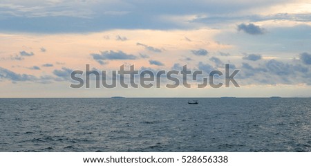 Sea in the evening time with a boat of fishing man