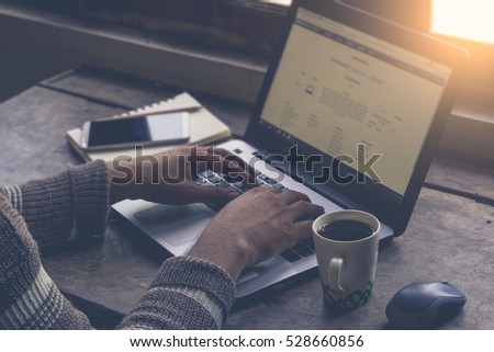 Businessman at work Close-up top view of man working on laptop  / soft focus picture / Vintage concept 