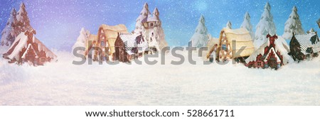 A house in a snowy Christmas landscape