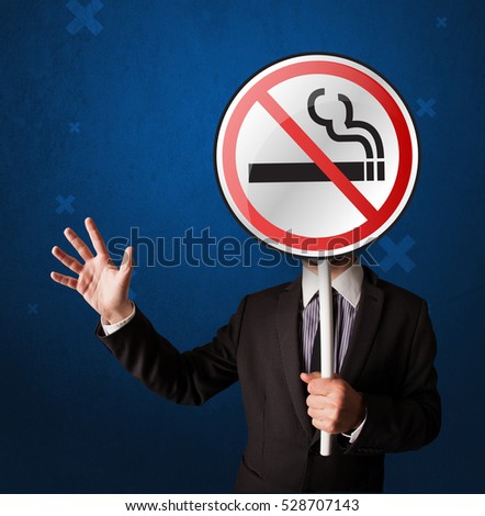 Smart businessman holding round sign with no smoking graphic