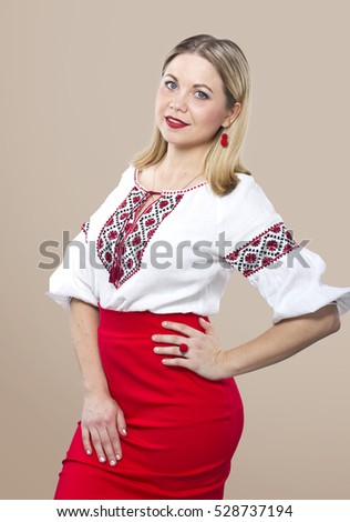 Beautiful girl in Ukrainian embroidery. Girl in a white embroidered blouse . Ukrainian holidays.