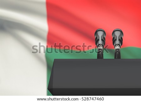 Pulpit and two microphones with a flag on background - Madagascar
