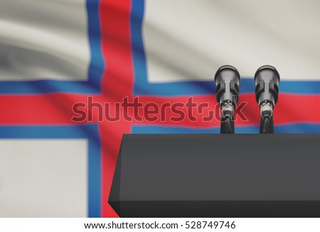 Pulpit and two microphones with a flag on background - Faroe Islands