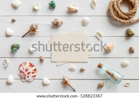 Empty photo for inside and nautical life style items: retro bottle with message, sea shells, chest, rope. Marine concept.

