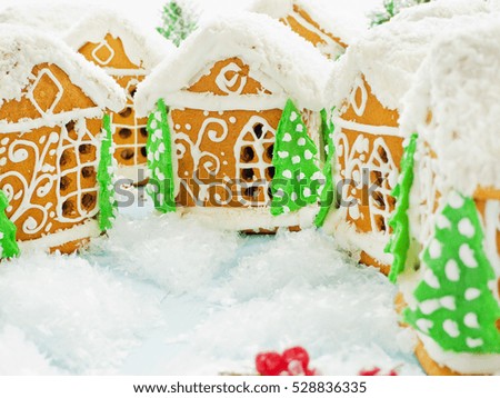 Christmas gingerbread houses on the blue background. Shallow dof.