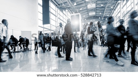 Blurred business people at a International Trade Fair hall