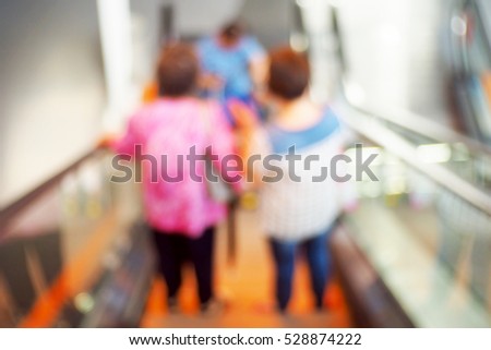 Blurred  background abstract and can be illustration to article of people on escalator