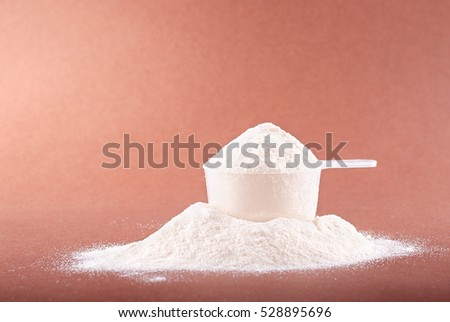 protein powder in a plastic spoon Royalty-Free Stock Photo #528895696