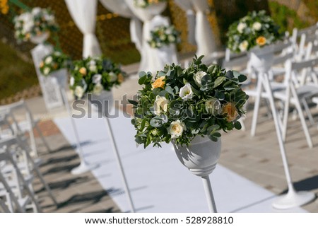 Wedding bouquet of  natural green flowers on stand.