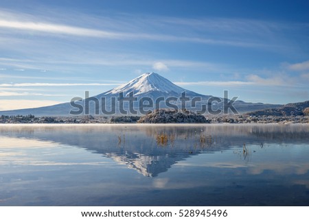 Mt Fuji reflection on water.Fujisan Mountain reflection on water. Royalty-Free Stock Photo #528945496