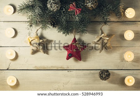 Christmas New year composition with candles on the old wooden background.Top view